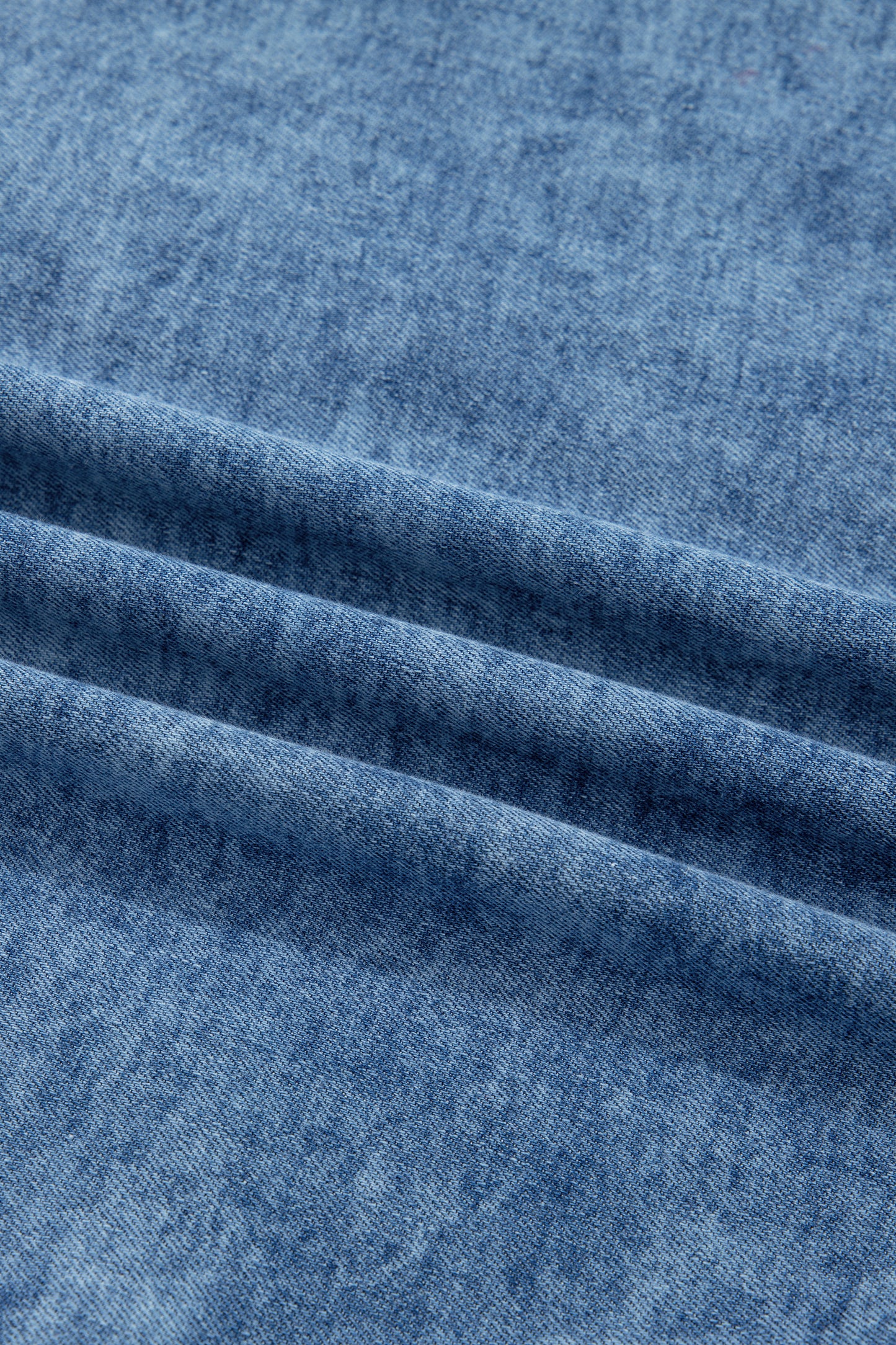 Women's Vintage Denim Wash Acid Wash Sleeveless Denim Button-Up Tank Top featuring a collared neckline, snap button front, western yoke, flap chest pockets, and curved hem.