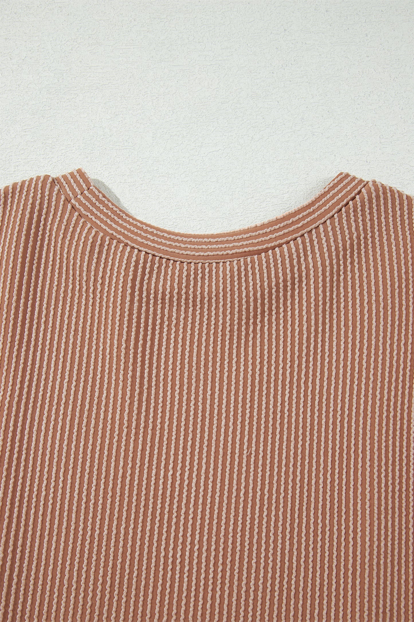 mocha brown leopard colorblock ribbed knit top with a round neckline, dropped shoulders, relaxed fit, and long sleeves.