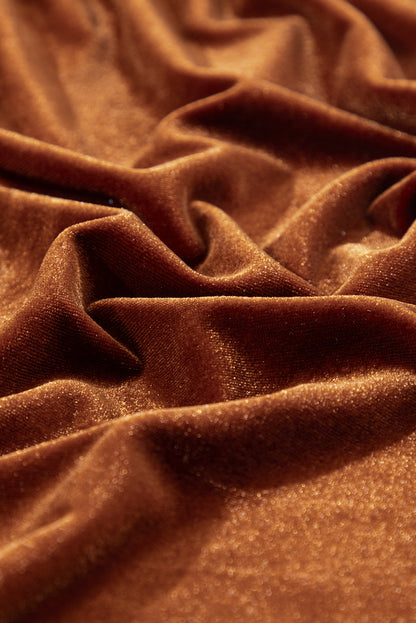 Women's caramel velvet mini dress featuring a ruffle mock neckline, long puff sleeves, elastic waist, and a fit-and-flare silhouette.