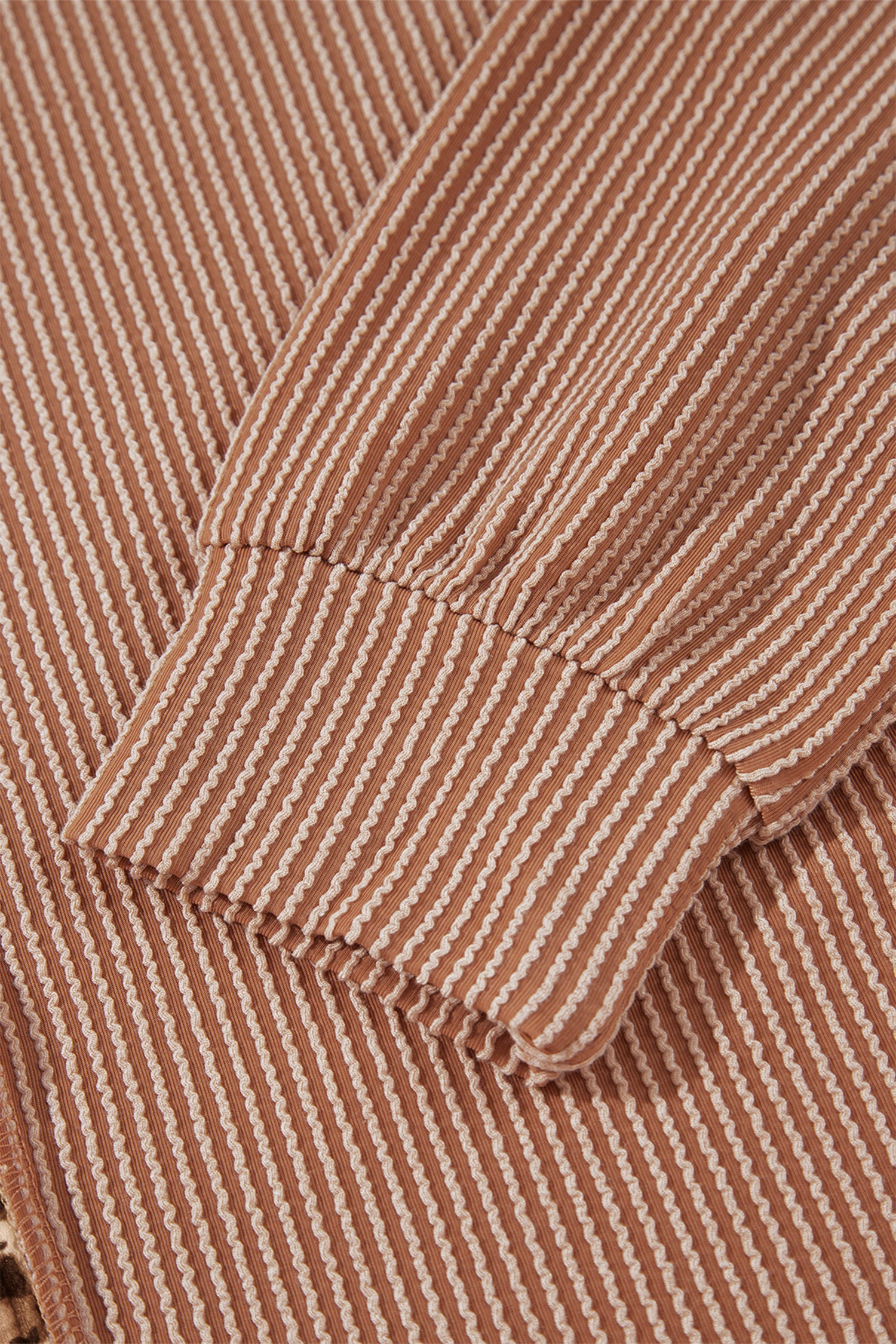 mocha brown leopard colorblock ribbed knit top with a round neckline, dropped shoulders, relaxed fit, and long sleeves.