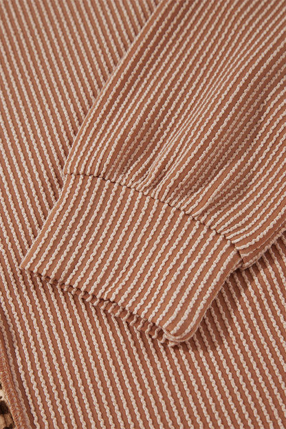 mocha brown leopard colorblock ribbed knit top with a round neckline, dropped shoulders, relaxed fit, and long sleeves.