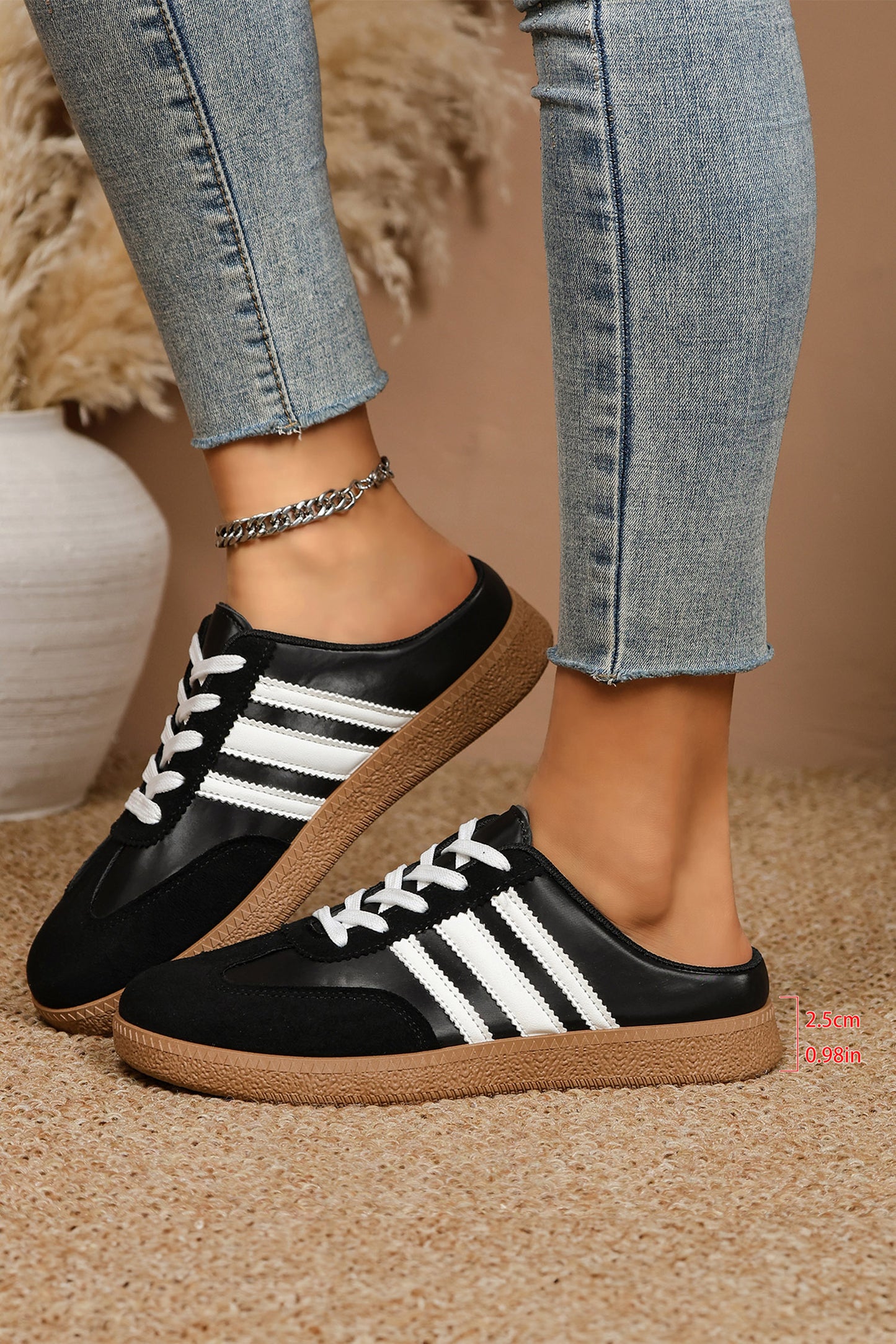 Women's Midnight Noir retro lace-up casual sneakers featuring a black faux leather upper, suede-look overlays, white side stripes, white laces, and a gum rubber sole.