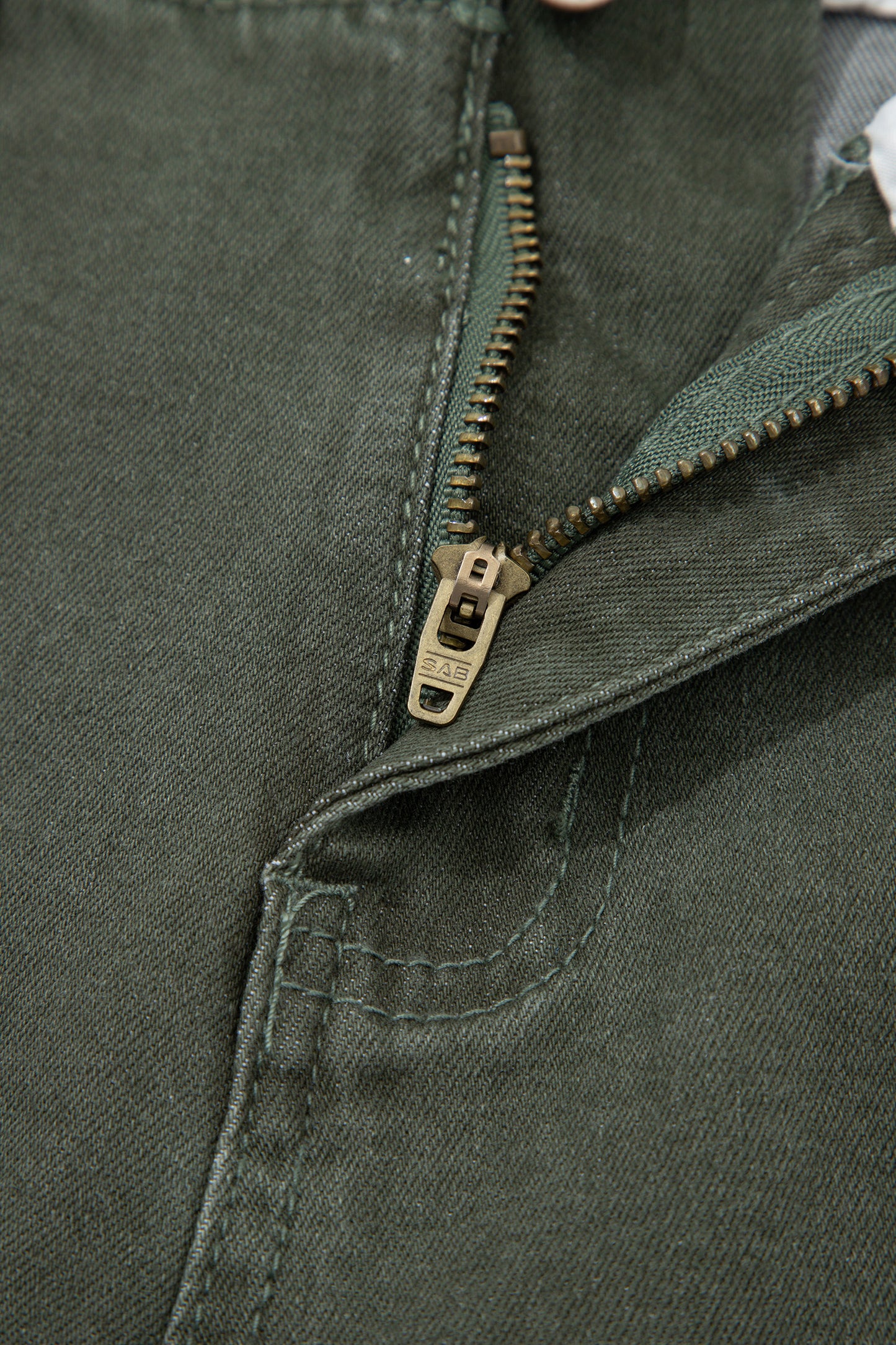 Olive green high rise wide leg jeans with double-button waistband, front pockets and cropped hem.
