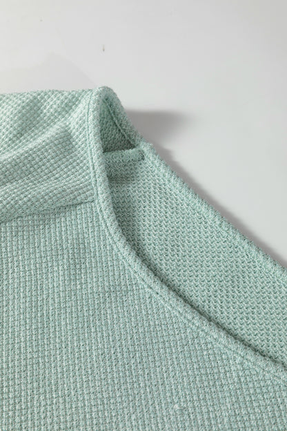 Seafoam Mist textured raglan long sleeve top with round neckline, relaxed fit, and curved hem