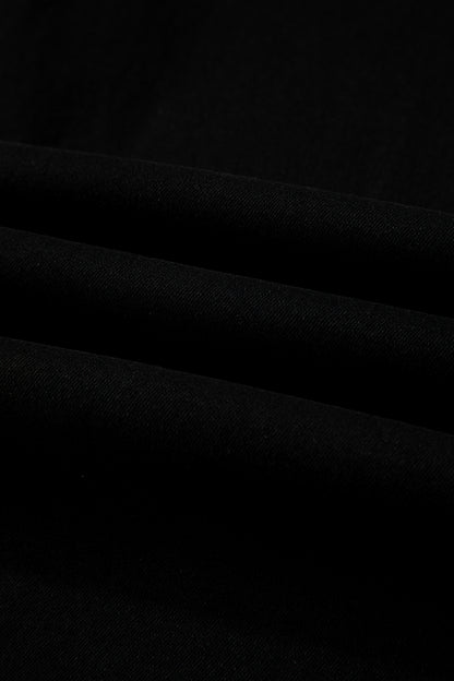 Black high rise wide leg jeans with double-button waistband, front pockets and cropped hem.