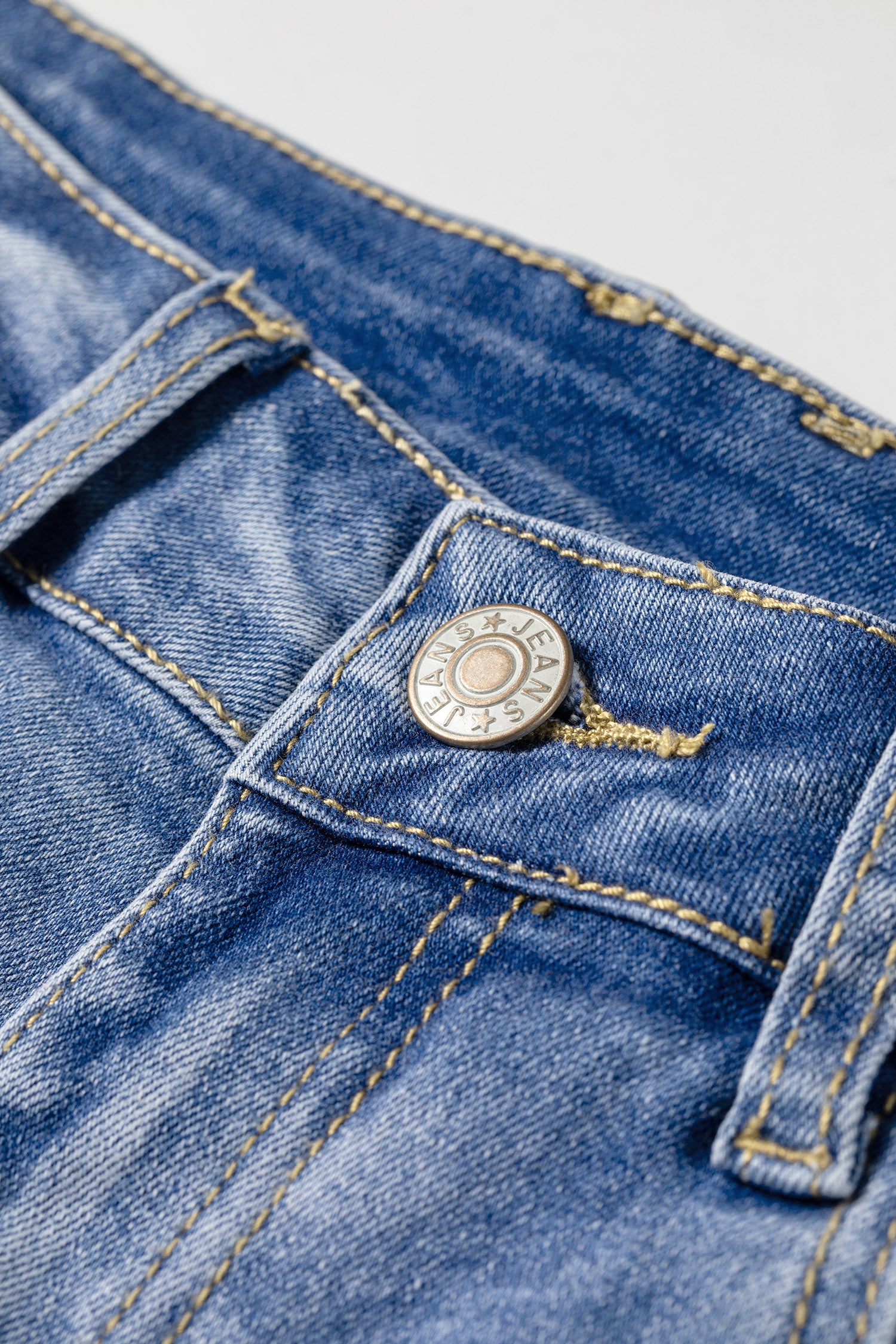 Light Wash Blue high rise Western flare jeans with embroidered lower-leg detailing and full-length wide leg silhouette.