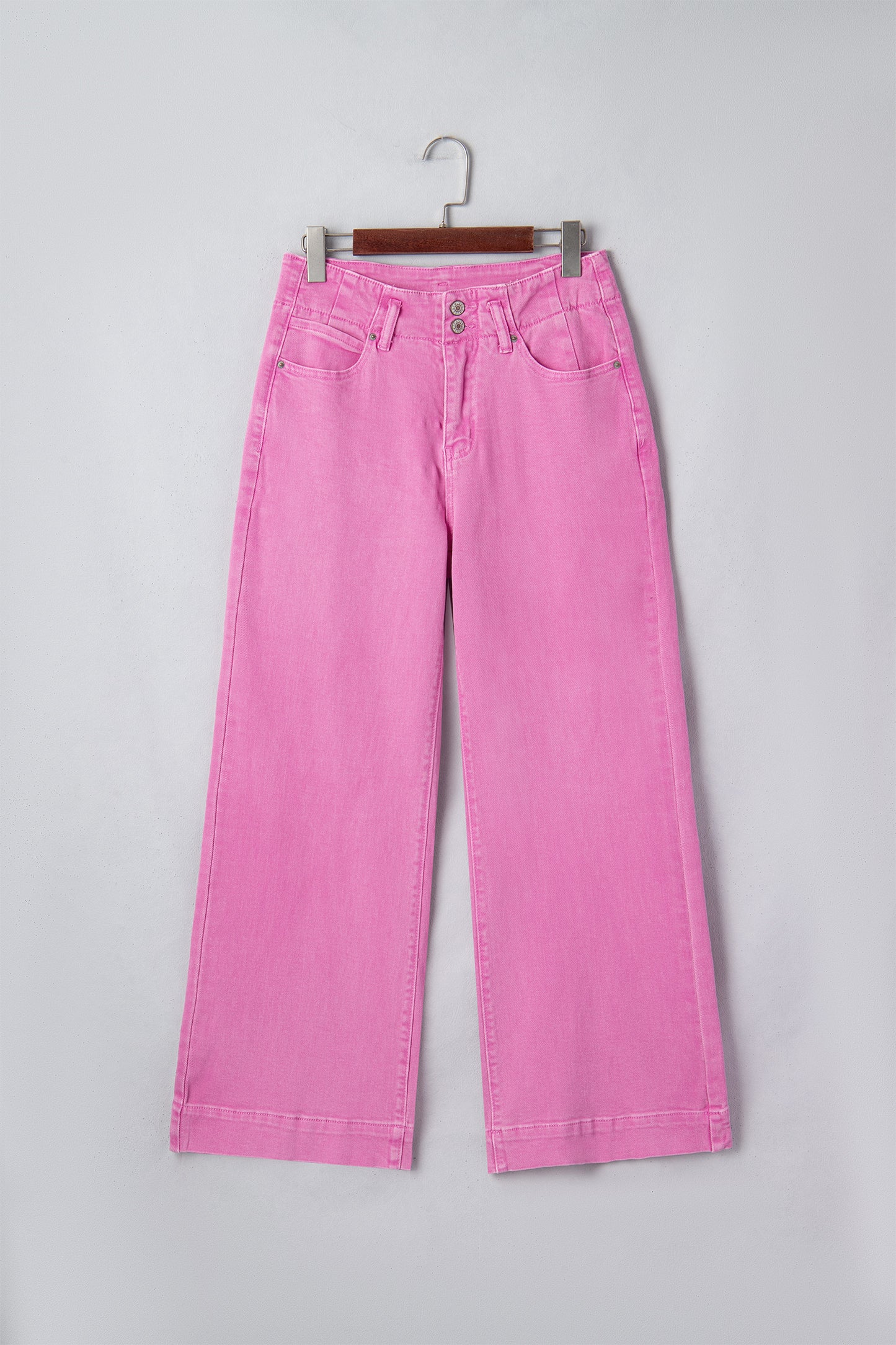 Pink high rise wide leg jeans with double-button waistband, front pockets and cropped hem.