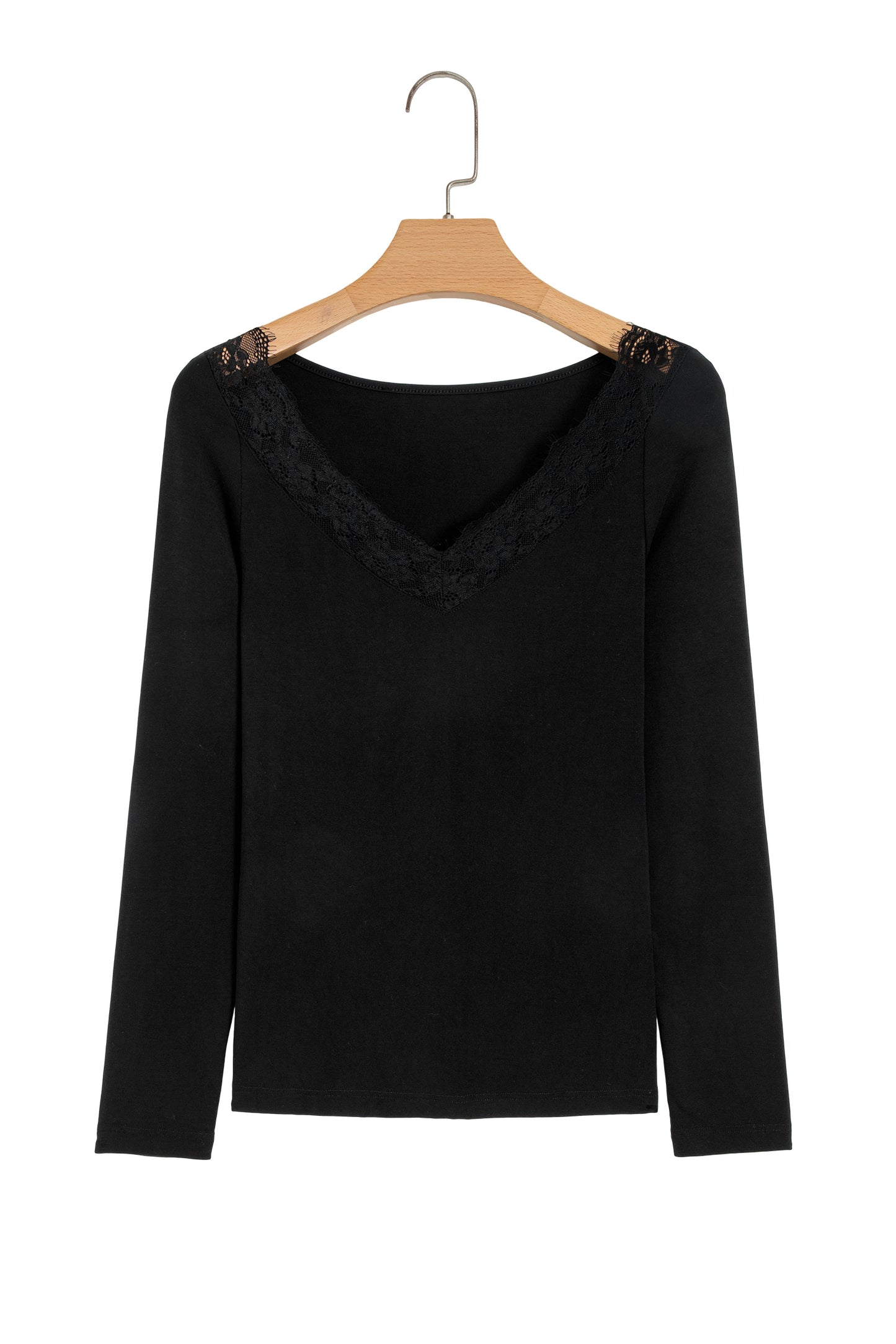 Black fitted long sleeve top with floral lace-trim V-neckline and soft stretch fabric styled with white pants.