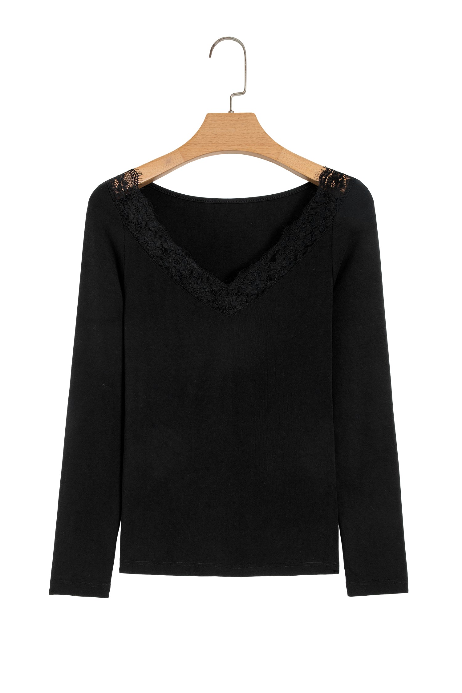 Black fitted long sleeve top with floral lace-trim V-neckline and soft stretch fabric styled with white pants.