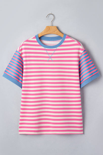 Pink and white textured striped knit short sleeve top with blue contrast ribbed neckline and sleeve cuffs, relaxed fit, and crew neckline.