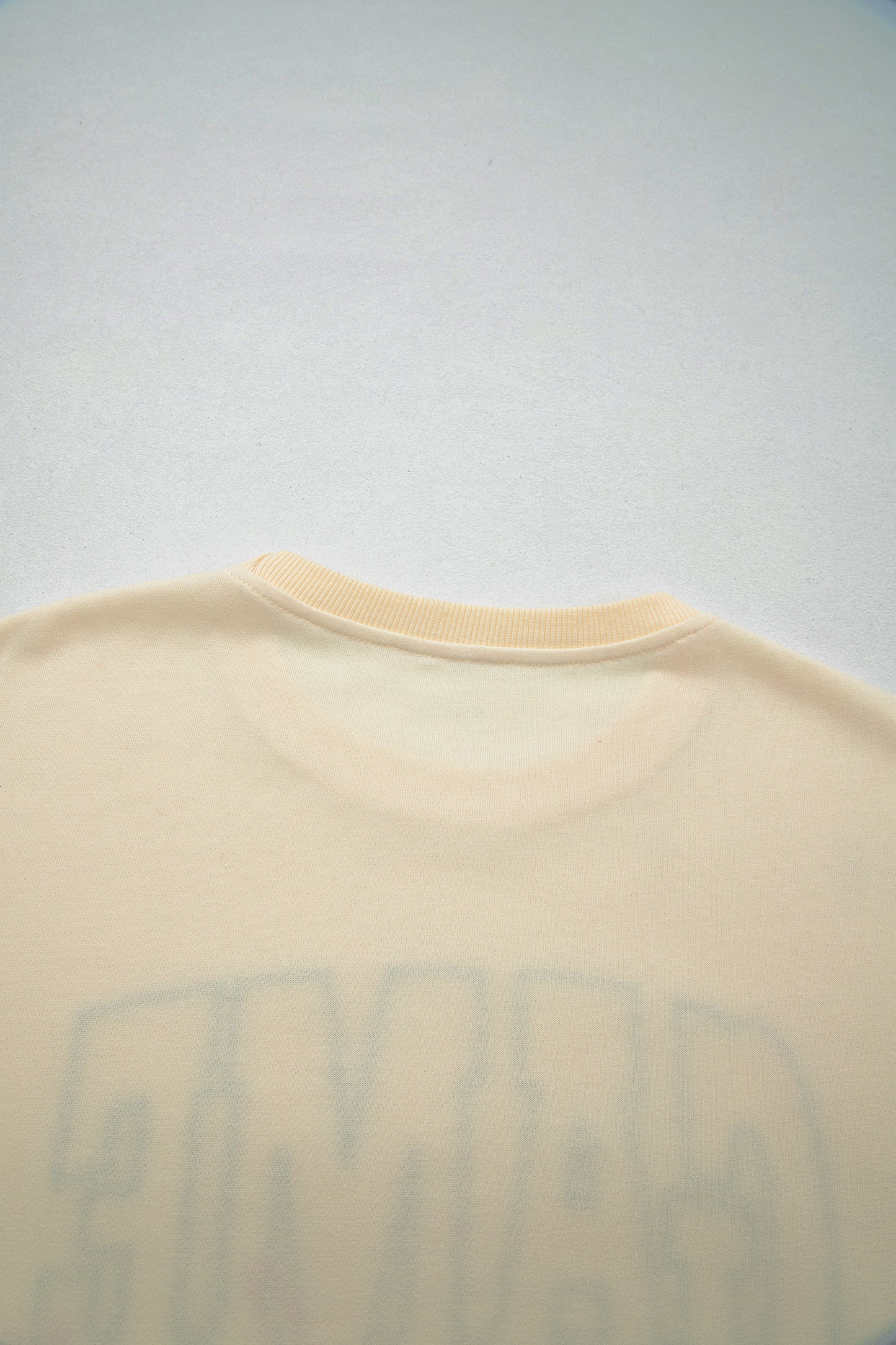 Cream Game Day embroidered sweatshirt and matching drawstring shorts set featuring long sleeves, blue contrast trim, relaxed fit, and casual sporty style.
