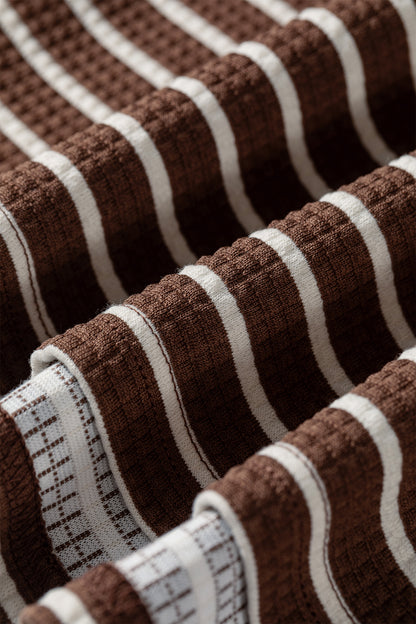 Cocoa Caramel and ivory striped colorblock pullover with a collared V-neckline, dropped shoulders, and long paneled sleeves.