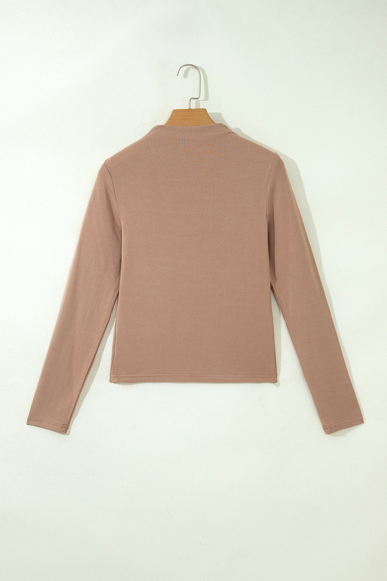 Warm taupe fitted high neck long sleeve top with a smooth stretch-knit finish and regular-length hem.