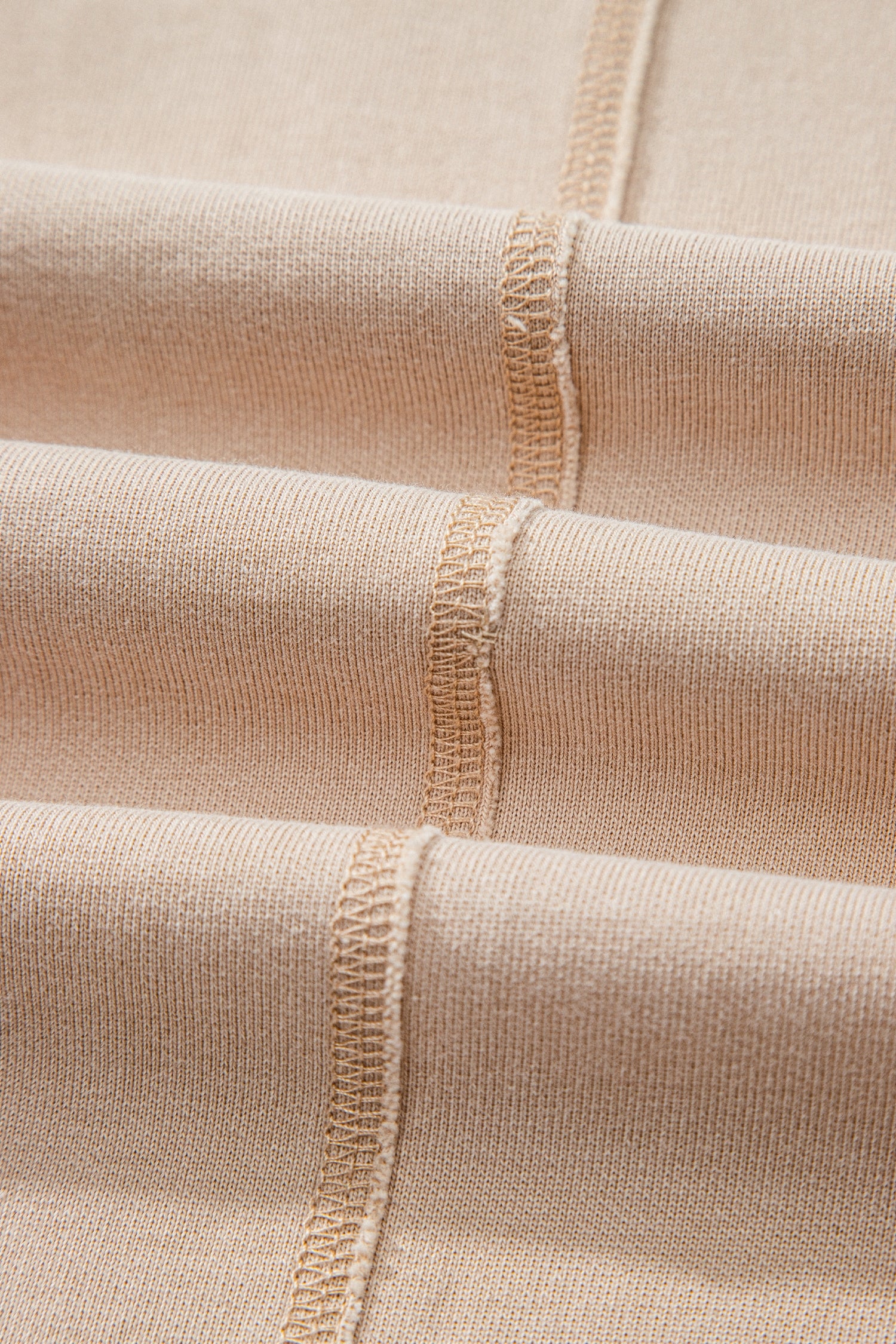 Sand washed cotton wide leg pants with drawstring waist, oversized patch pockets, and relaxed fit.