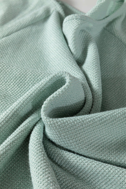Seafoam Mist textured raglan long sleeve top with round neckline, relaxed fit, and curved hem