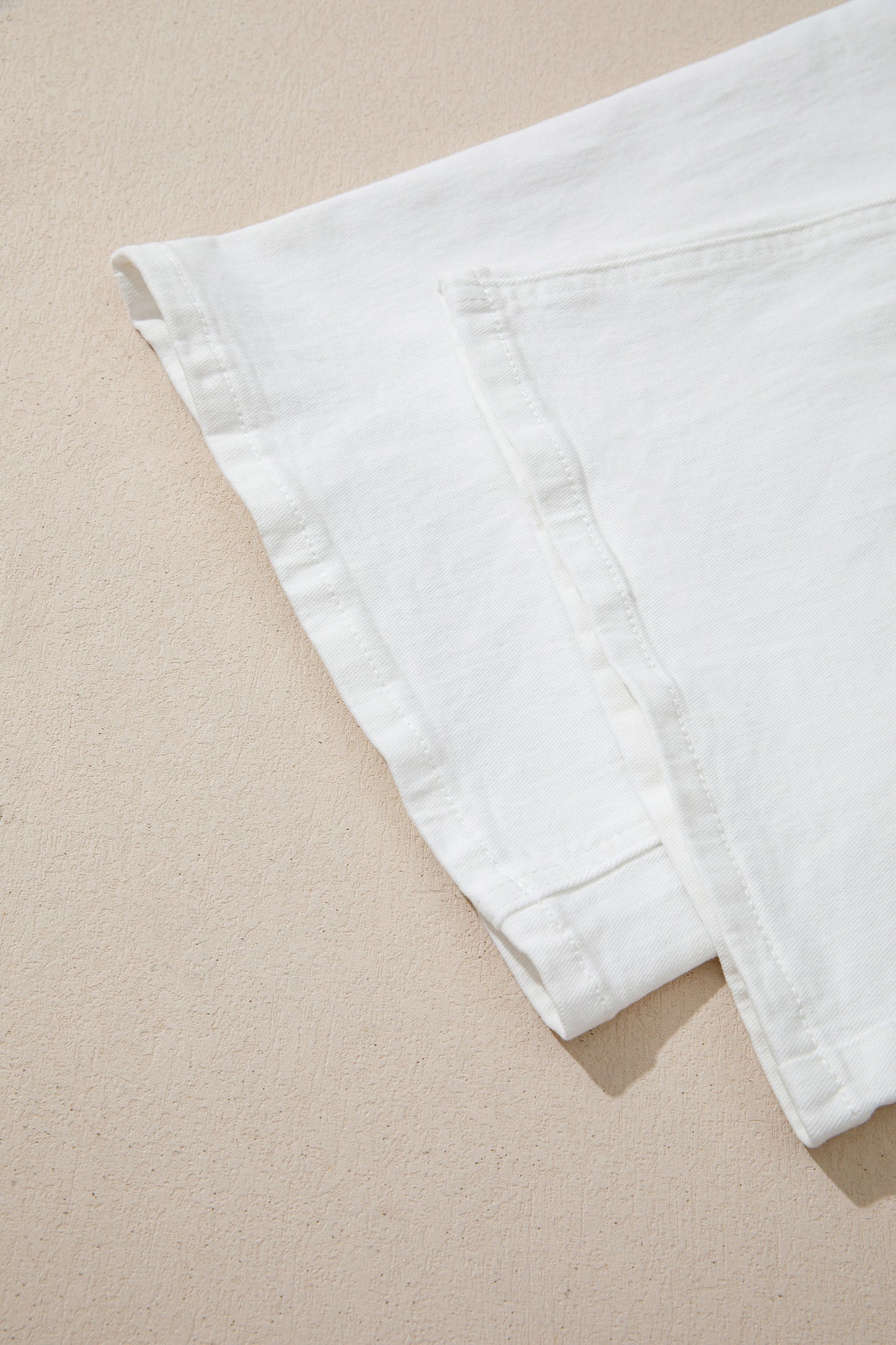 Women’s white high-waist wide-leg jeans with classic five-pocket styling and a relaxed full-length silhouette