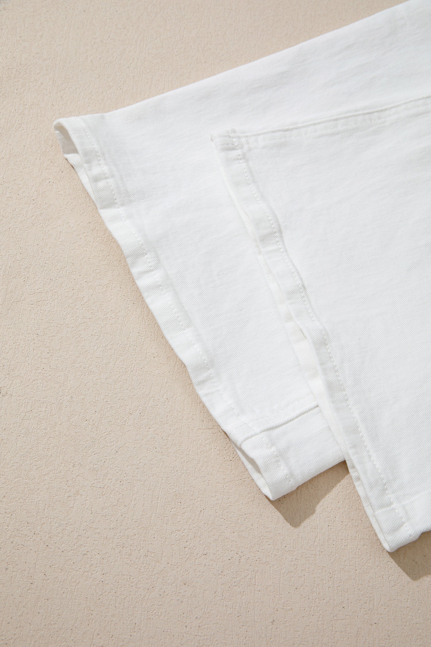 Women’s white high-waist wide-leg jeans with classic five-pocket styling and a relaxed full-length silhouette