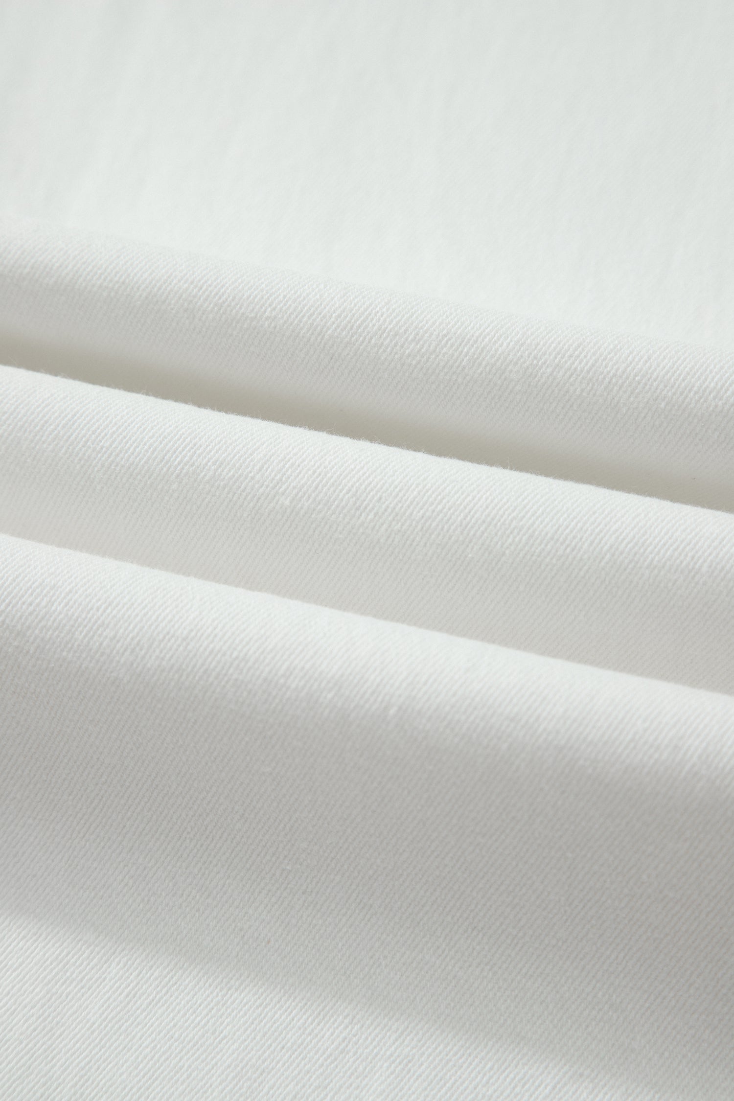 White high rise wide leg jeans with double-button waistband, front pockets and cropped hem.