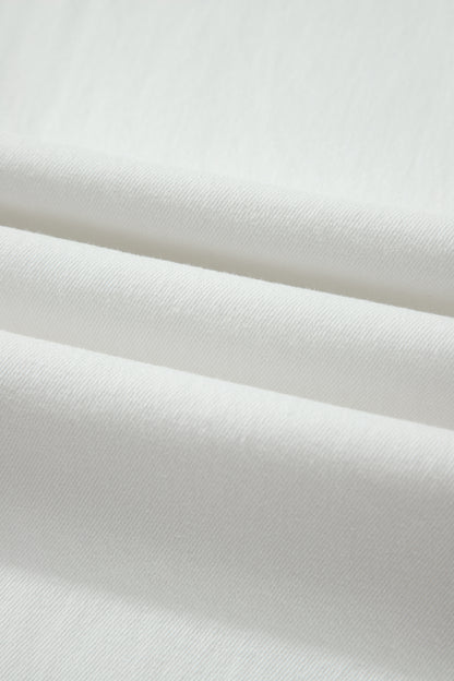 White high rise wide leg jeans with double-button waistband, front pockets and cropped hem.