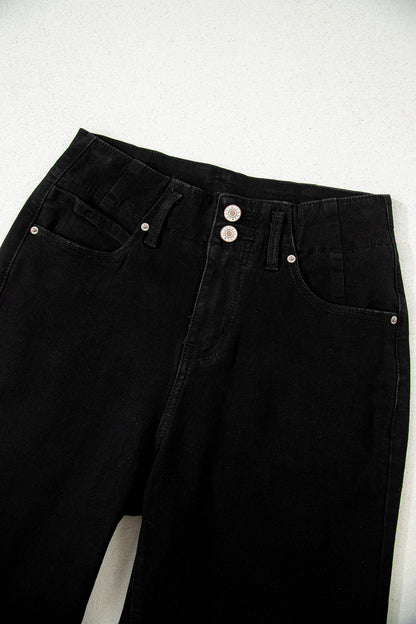Black high rise wide leg jeans with double-button waistband, front pockets and cropped hem.