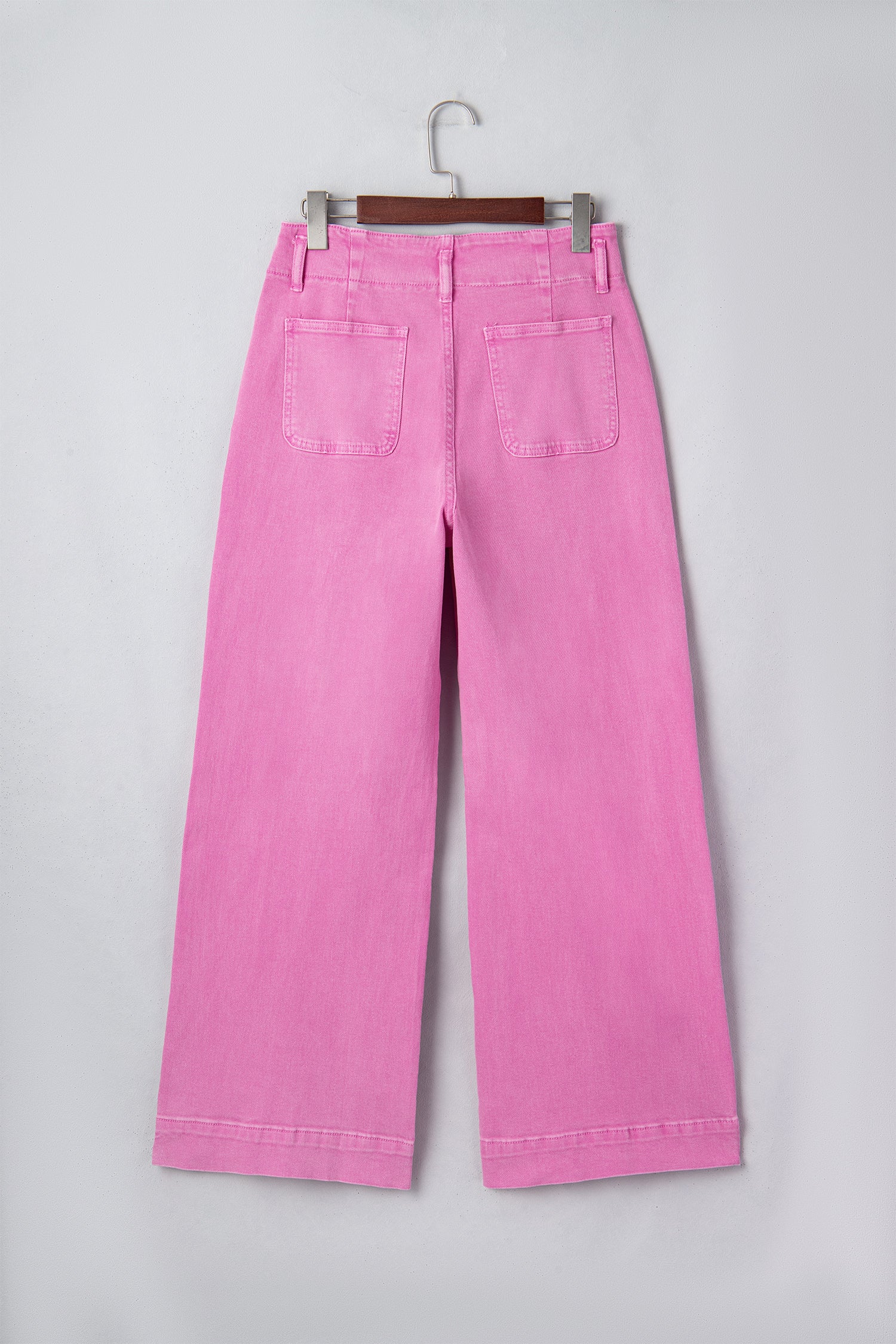 Pink high rise wide leg jeans with double-button waistband, front pockets and cropped hem.