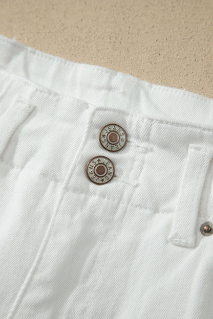 White high rise wide leg jeans with double-button waistband, front pockets and cropped hem.
