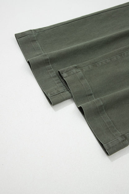 Olive green high rise wide leg jeans with double-button waistband, front pockets and cropped hem.
