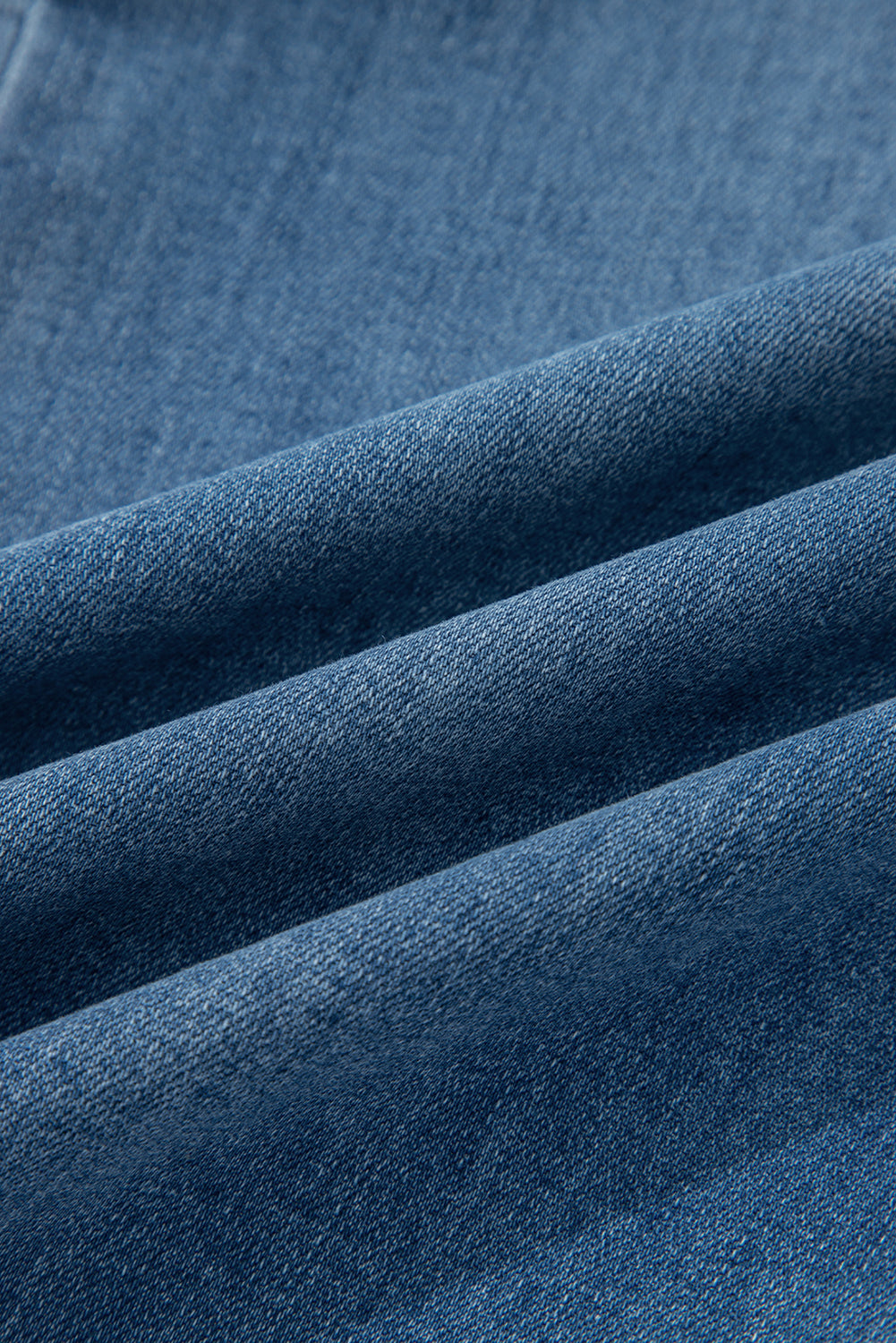 Women's medium wash denim high waist wide leg jeans with button fly closure, front patch pockets, and stretch denim.