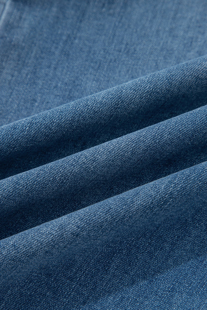 Women's medium wash denim high waist wide leg jeans with button fly closure, front patch pockets, and stretch denim.