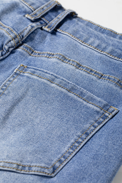 Light Wash Blue high rise Western flare jeans with embroidered lower-leg detailing and full-length wide leg silhouette.