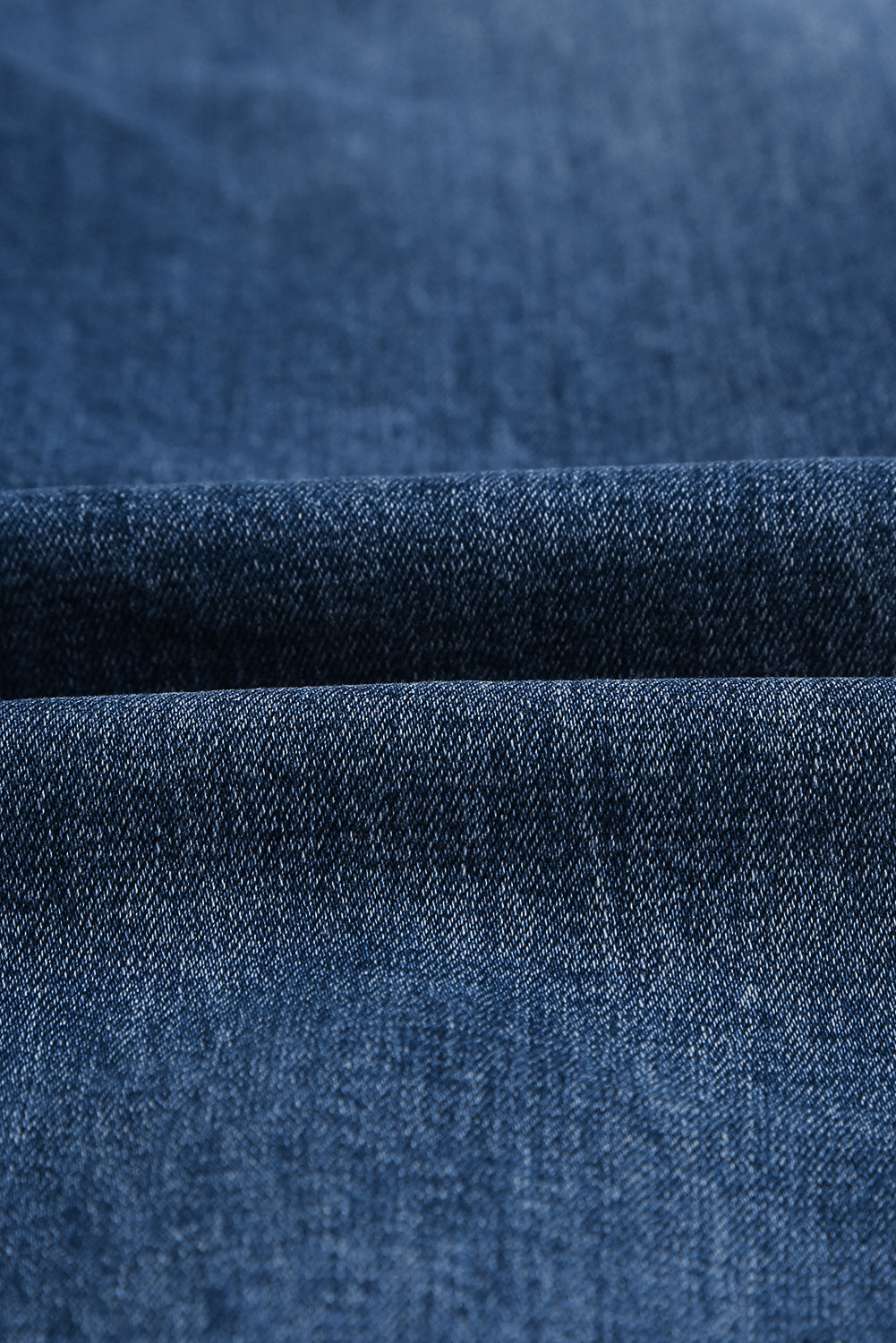 Medium wash blue distressed slim straight leg jeans with drawstring elastic waist and raw hem