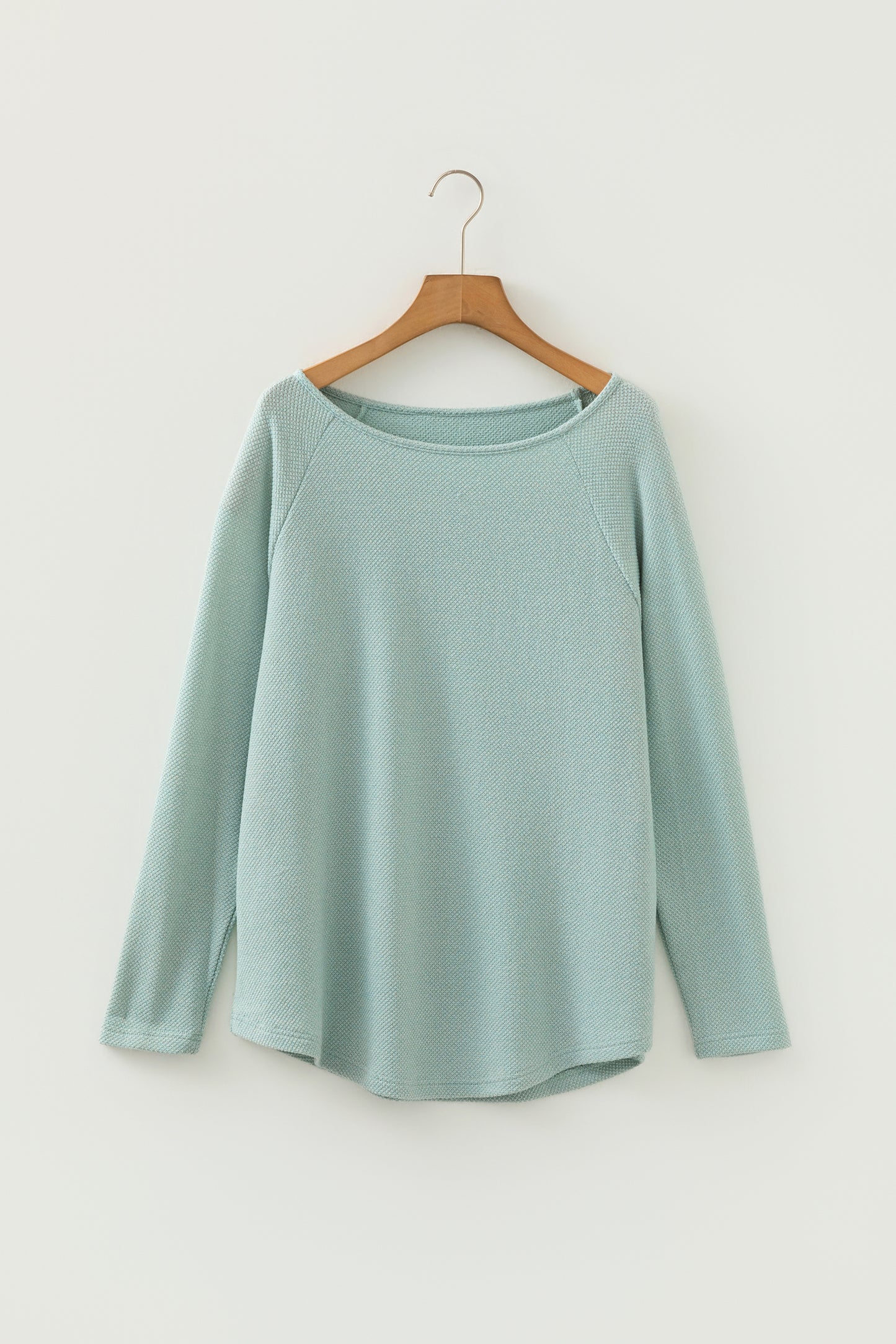 Seafoam Mist textured raglan long sleeve top with round neckline, relaxed fit, and curved hem