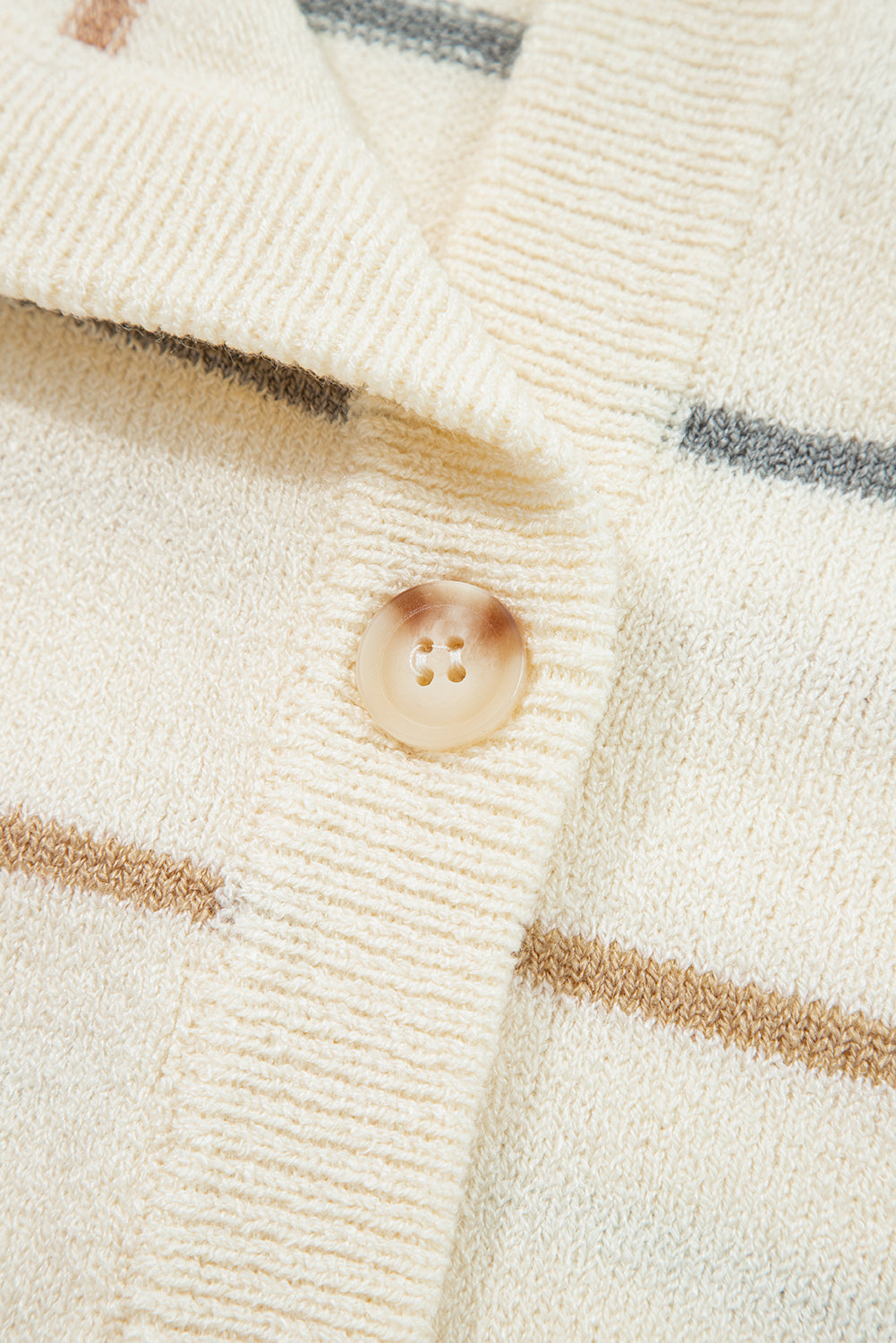 Cream striped button-front cardigan with camel tan and dusty blue-gray stripes, V-neckline, and relaxed drop-shoulder sleeves