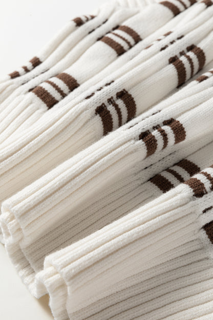 Oatmeal knit sweater vest with brown striped pattern, V-neckline, sleeveless design, and ribbed trim.