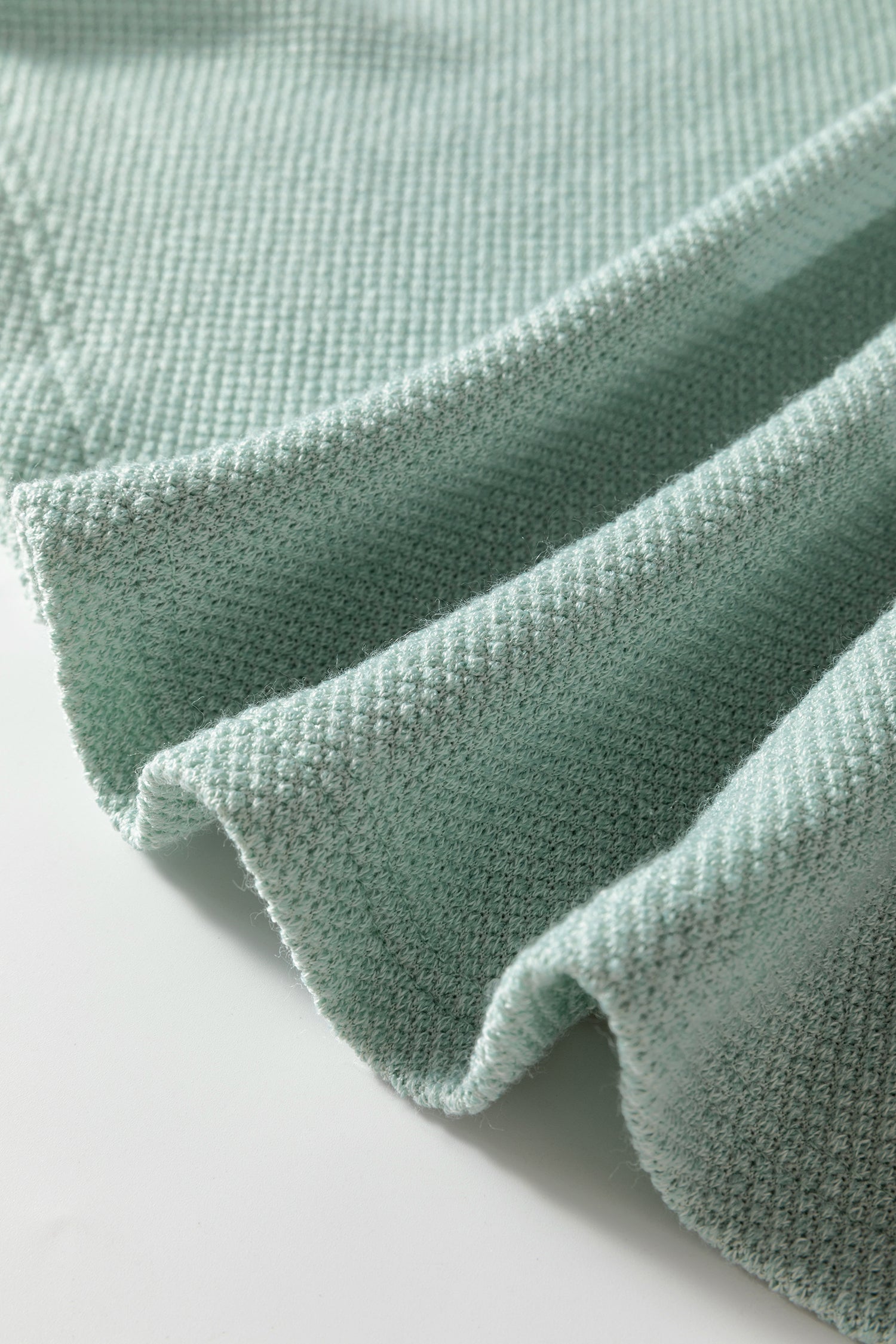 Seafoam Mist textured raglan long sleeve top with round neckline, relaxed fit, and curved hem