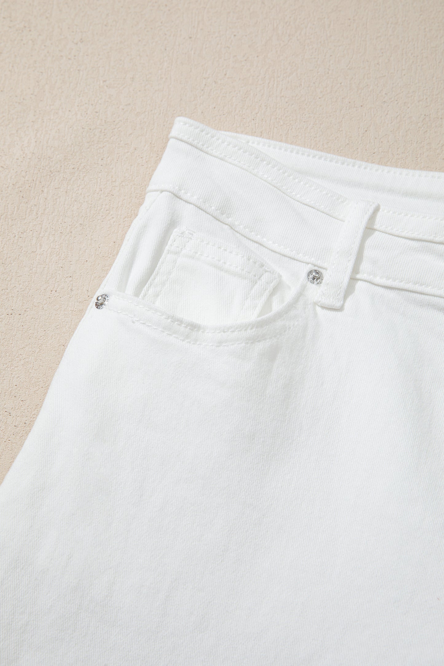 Women’s white high-waist wide-leg jeans with classic five-pocket styling and a relaxed full-length silhouette