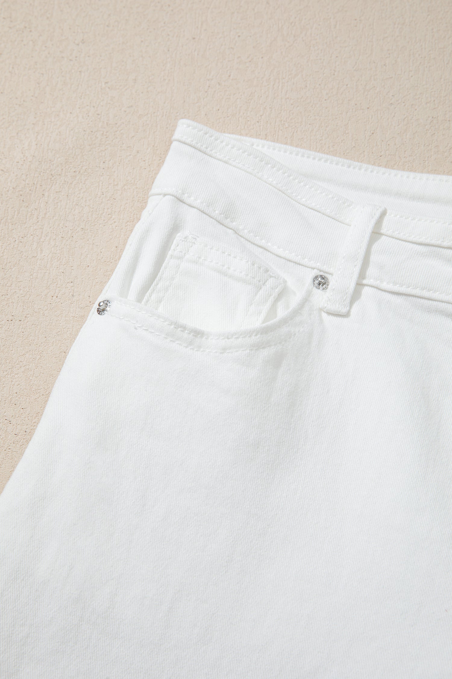 Women’s white high-waist wide-leg jeans with classic five-pocket styling and a relaxed full-length silhouette