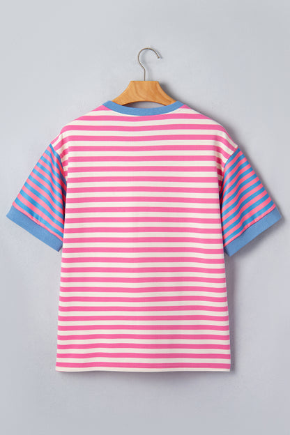 Pink and white textured striped knit short sleeve top with blue contrast ribbed neckline and sleeve cuffs, relaxed fit, and crew neckline.