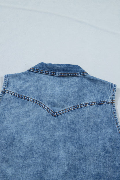 Women's Vintage Denim Wash Acid Wash Sleeveless Denim Button-Up Tank Top featuring a collared neckline, snap button front, western yoke, flap chest pockets, and curved hem.