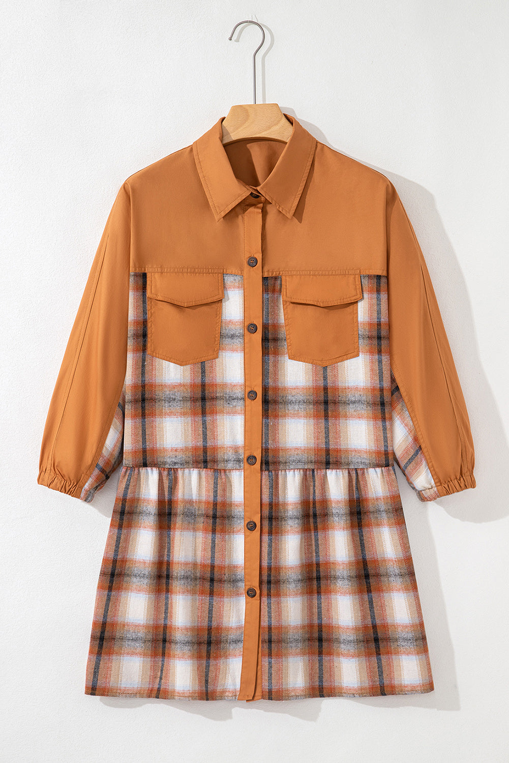 Caramel plaid tunic shirt dress with collared neckline, button front, chest pockets, long sleeves, and relaxed mini silhouette.