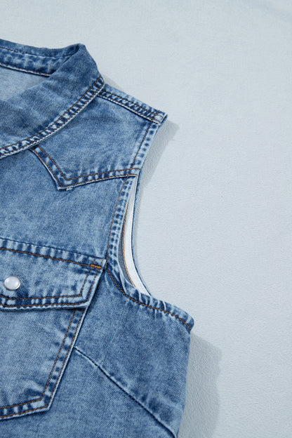 Women's Vintage Denim Wash Acid Wash Sleeveless Denim Button-Up Tank Top featuring a collared neckline, snap button front, western yoke, flap chest pockets, and curved hem.