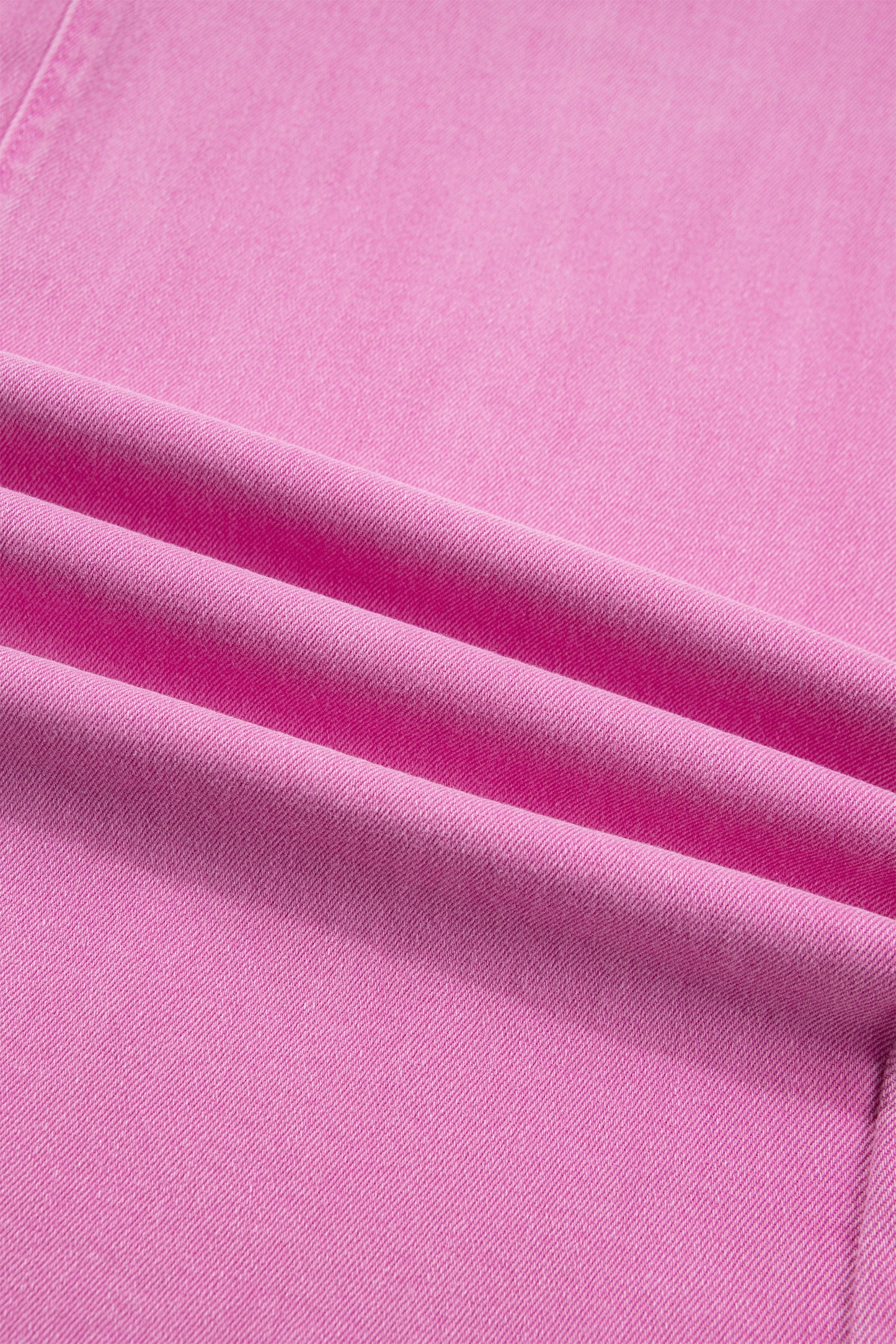 Pink high rise wide leg jeans with double-button waistband, front pockets and cropped hem.