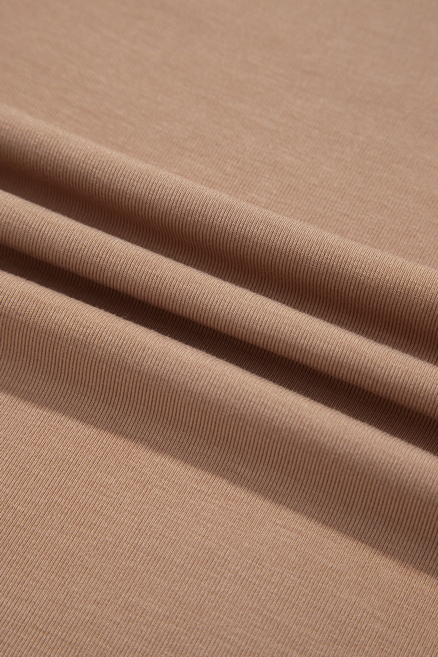 Warm taupe fitted high neck long sleeve top with a smooth stretch-knit finish and regular-length hem.