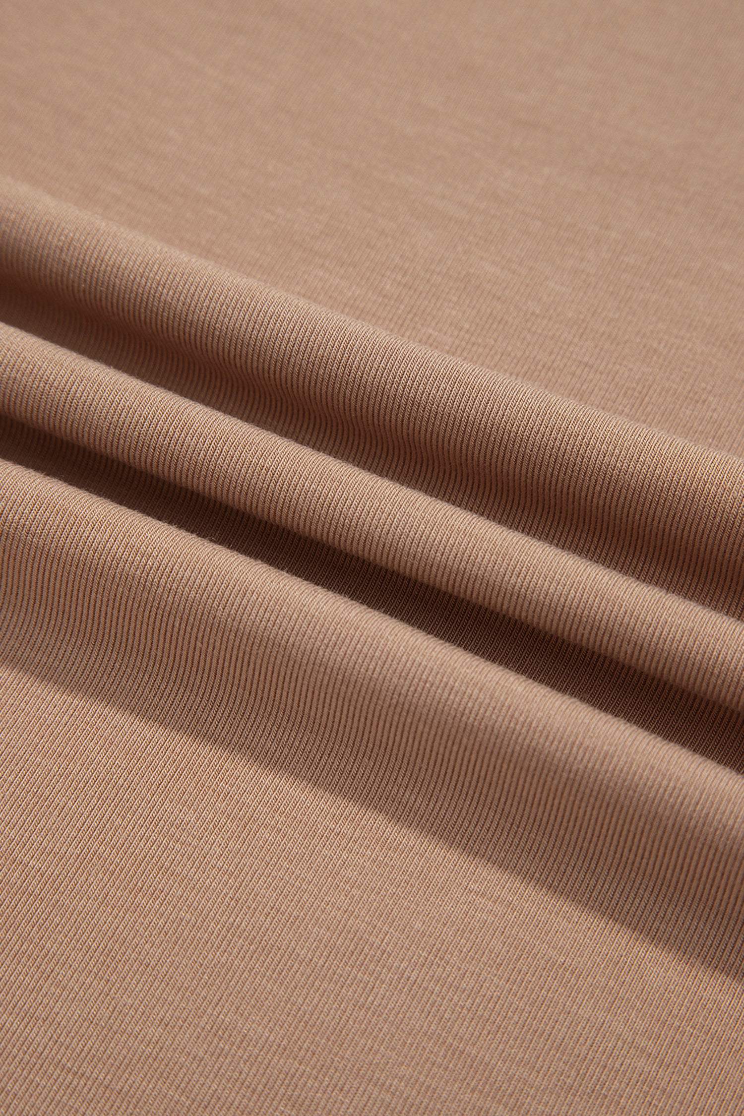 Warm taupe fitted high neck long sleeve top with a smooth stretch-knit finish and regular-length hem.
