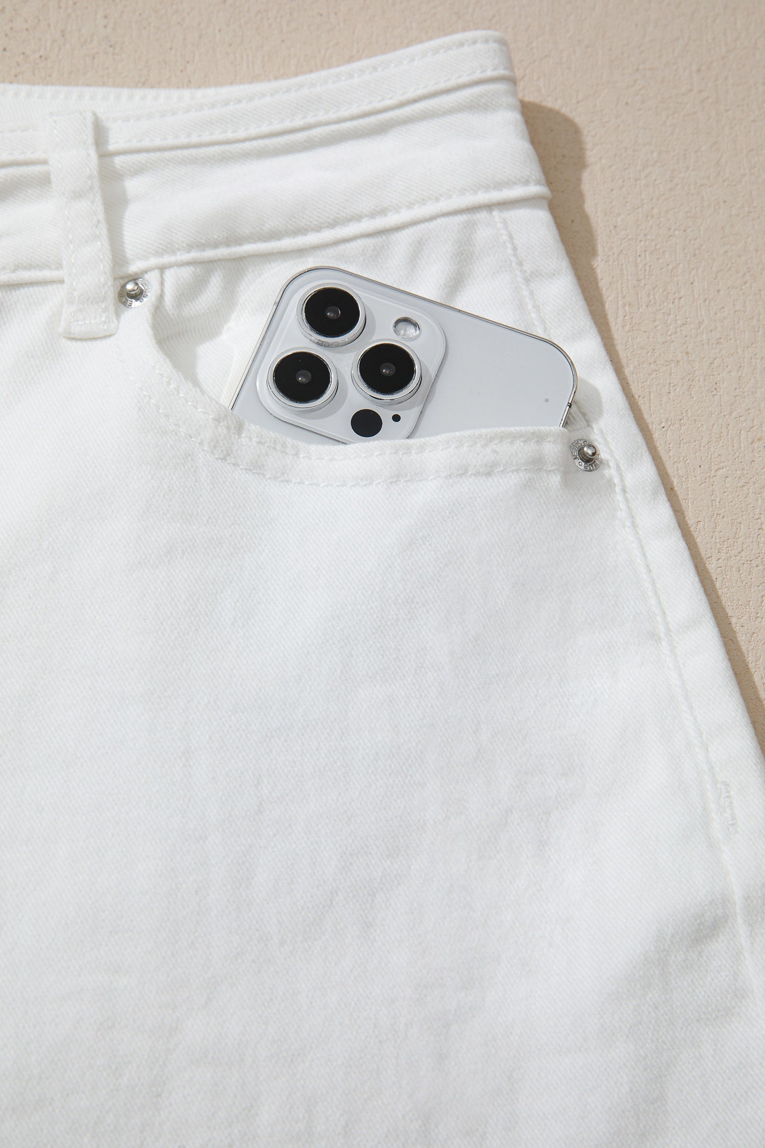 Women’s white high-waist wide-leg jeans with classic five-pocket styling and a relaxed full-length silhouette
