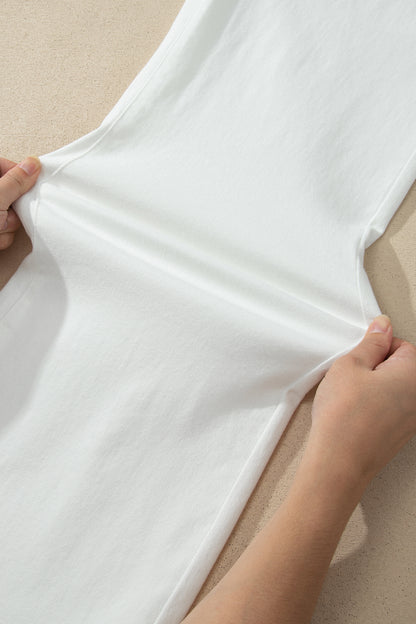 White high rise wide leg jeans with double-button waistband, front pockets and cropped hem.