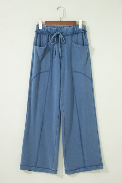 Dusty Blue washed cotton wide leg pants with drawstring waist, oversized patch pockets, and relaxed fit.