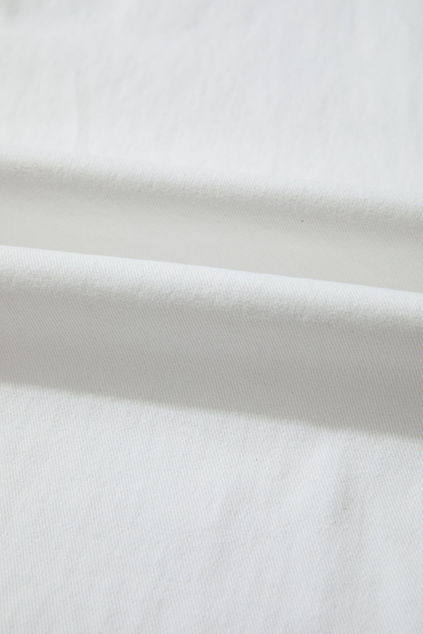 Women’s white high-waist wide-leg jeans with classic five-pocket styling and a relaxed full-length silhouette