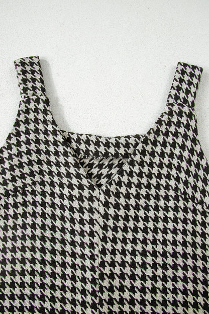 Black textured houndstooth jacquard sleeveless mini dress with V-neckline and A-line silhouette.