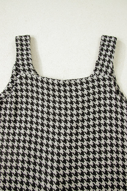 Black textured houndstooth jacquard sleeveless mini dress with V-neckline and A-line silhouette.